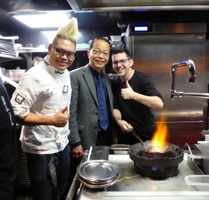 StreetXO chefs around wok